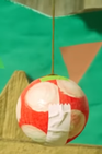 Two differently colored Party Balls in Yoshi's Crafted World