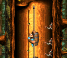Barrel Shield Bust-Up The first level (fourth in the remake), Barrel Shield Bust-Up involves Dixie and Kiddy having to climb ropes while hiding behind Barrel Shields to avoid taking damage from the acorn-throwing Minkeys.