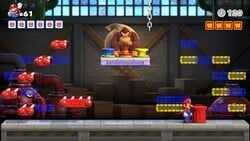 Screenshot of Mario Toy Factory level 1-DK+ from the Nintendo Switch version of Mario vs. Donkey Kong