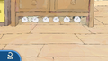 The dust balls, blown under the drawer.