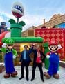 Miyamoto alongside Shinya Takahashi, Mario, and Luigi at the grand opening of Super Nintendo World (Universal Studios Hollywood)