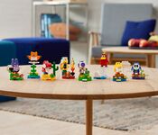 The LEGO Super Mario Character Packs announced at LEGOCON, including Nabbit, a Waddlewing, a Red Yoshi, a Hammer Bro, a Purple Toad, a Toady, a Yellow Baby Yoshi, and a Blue Shy Guy