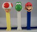 Pez dispensers of Mario, Yoshi, and Toad.