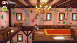 Mario standing near a Coin in Toad Town of The Origami King.