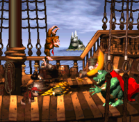 Donkey Kong and Diddy Kong battle King K. Rool on the Gangplank Galleon.