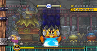 A screenshot of Wario fighting the Shake King.