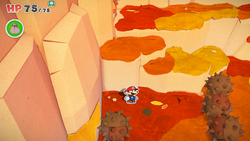 Mario standing near a hole containing a Healing Heart in Chestnut Valley of The Origami King.