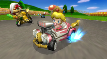 Baby Peach racing in N64 Mario Raceway in Mario Kart Wii.