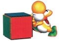A Yellow Yoshi pushing a block in Yoshi's Story.