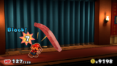 Mario blocks an attack from the steak