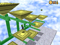 Luigi jumping across the pyramid platforms in Rainbow Ride