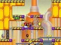 A Mini Mario breaking through several rocks with Hammers in Mario vs. Donkey Kong: Tipping Stars