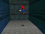 Mario entering the wall of Shifting Sand Land