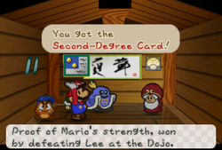 Mario receiveing a Second-Degree Card from Master in Toad Town of Paper Mario.