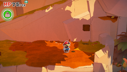 Mario standing near a hole containing a 100-Coin in Chestnut Valley of The Origami King.