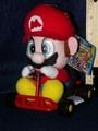 A plushie of Mario from Super Mario Kart