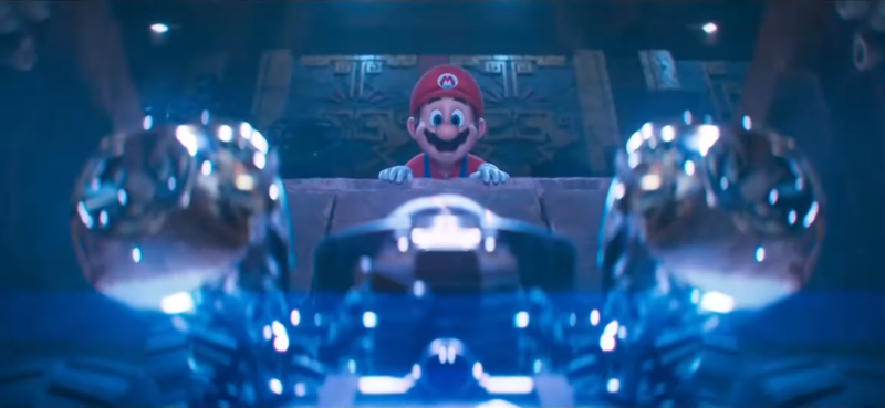File:Mario watches his kart being assembled - TSMBM.png