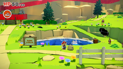 Mario standing near a rock containing a Small Bag of Confetti in Picnic Road of The Origami King.