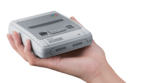 Hand holding UK SNES mini as scale.