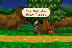 Mario finding a Star Piece in the tree near the Goomba King's Fortress in Paper Mario.