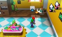 Mario and Luigi standing under a Camera Block.