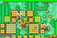 Donkey Kong collecting some bananas near two Zingers in Cactus Woods of DK: King of Swing