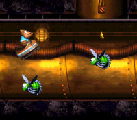Kiddy Kong jumps over a Buzz in Demolition Drain-Pipe of Donkey Kong Country 3: Dixie Kong's Double Trouble!.