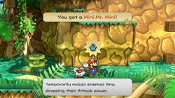 Mario getting a Mini Mr. Mini from a bush in Keelhaul Key of Paper Mario: The Thousand-Year Door for Nintendo Switch.