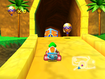 Tiptup drives to the Golden Balloon lying outside of Dino Domain's entrance.