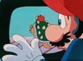 Mario watches in horror as the princess is taken away