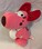 A plushie of Birdo holding an egg.