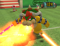 Bowser using his Fire Breath Power Shot in Mario Power Tennis
