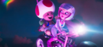Peach using her bike to save Toad after his kart is destroyed