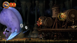 Big Squeekly gets defeated just before the Slot Machine Barrel of Crowded Cavern in Donkey Kong Country Returns