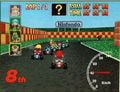 A race at Mario Raceway in an early build. Note the presence of Kamek, the Nintendo sign, and the early HUD.