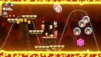 The second 10-flower coin in the Wavy Ride through the Magma Tube level in Super Mario Bros. Wonder