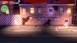 Mario standing near a Healing Heart in Big Sho' Theater of The Origami King.