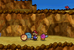 Mario collecting a Whacka Bump after hitting Whacka in the second scene of Mt. Rugged of Paper Mario.