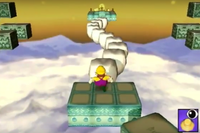 Wario about to cross a row of marshmallow blocks.