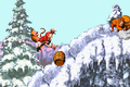Expresso and the Kongs jump over a barrel thrown by a Manky Kong in the Game Boy Advance version