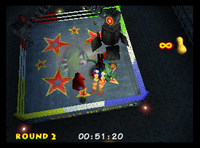 Diddy Kong fighting against King Krusha K. Rool during the second round of the boxing arena in Donkey Kong 64