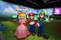 Mario, Luigi, and Princess Peach mascots at the game's area during Nintendo Live at PAX West 2023