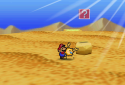 Image of Mario revealing a hidden ? Block in Dry Dry Desert, in Paper Mario.