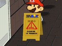 The floor sign near the female restroom in Merlee's Basement in Super Paper Mario