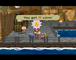 Mario getting 11 Coins from Bomberto in Rogueport of Paper Mario: The Thousand-Year Door.