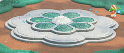 The Flower Pedestal located in Camp Central in Super Mario Bros. Wonder – Nintendo Switch 2 Edition + Meetup in Bellabel Park.