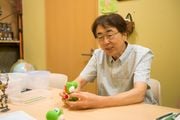 Animator Hirokazu Minegishi with a Yoshi puppet