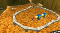 A screenshot of Cataquacks approching Mario at the Gold Leaf Galaxy.