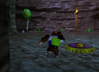 A green Banana Balloon and a set of green Banana Coins in Crystal Caves.