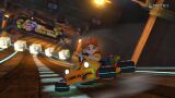 Princess Daisy racing on Wario's Gold Mine in Mario Kart 8.